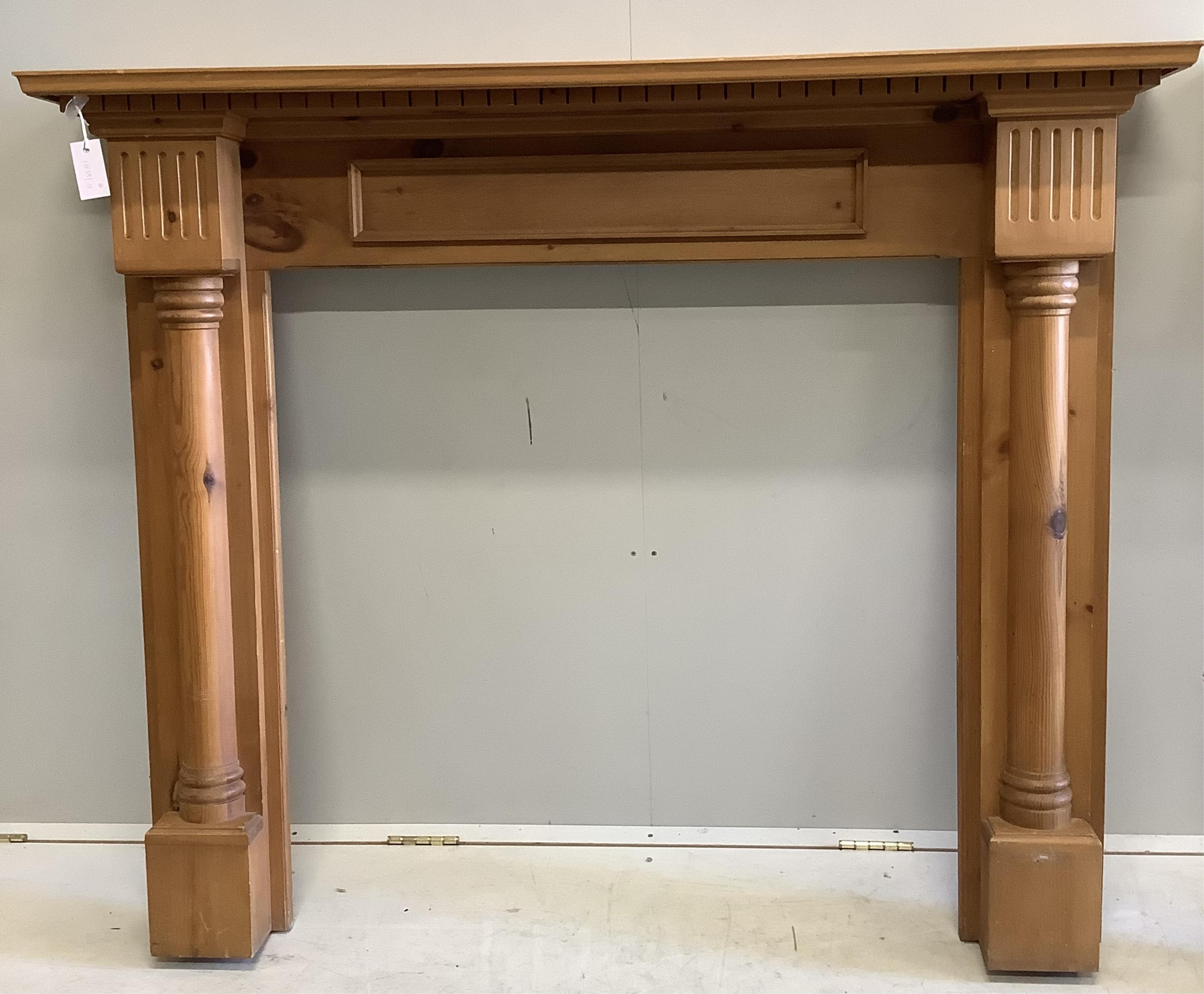 An 18th century style painted pine fire surround and one other, larger width 138cm, height 116cm. Condition - fair